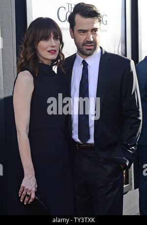 Ron Livingston attends with wife Rosemarie DeWitt the premiere of 'The Conjuring' at the Cinerama Dome in Los Angeles on July 15, 2013.  Based upon a true story, the movie tells of world renowned paranormal investigators Ed and Lorraine Warren and how they were called upon to help a terrorized family at a secluded farmhouse.     UPI/Jim Ruymen Stock Photo