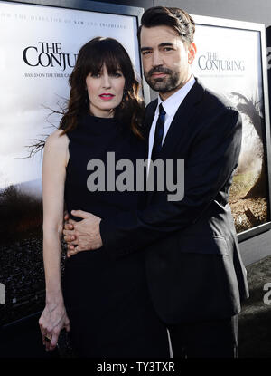 Ron Livingston attends with wife Rosemarie DeWitt the premiere of 'The Conjuring' at the Cinerama Dome in Los Angeles on July 15, 2013.  Based upon a true story, the movie tells of world renowned paranormal investigators Ed and Lorraine Warren and how they were called upon to help a terrorized family at a secluded farmhouse.     UPI/Jim Ruymen Stock Photo