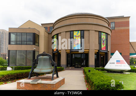 Grand Rapids , Michigan, USA - June 15, 2019: The  Andel Museum Center, Public Museum, with a space capsule and a historic bell at the entrance Stock Photo