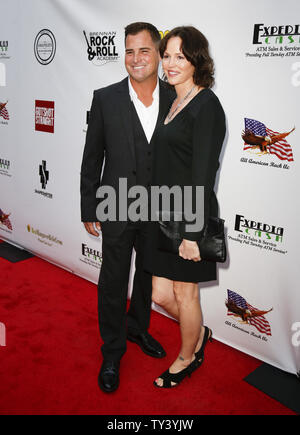 Cast member George Eads (L) of 'Gutshot Straight,' and actress Jorja Fox, who work together on the television show CSI: Crime Scene Investigation, attend the premiere of the motion picture thriller 'Gutshot Straight', at the Zanuck Theatre at Fox Studios in Los Angeles on August 12, 2013.  The crime story follows Eads’s Jack, a poker player who takes on Lang and Levine brothers in the Vegas underworld, with AnnaLynne McCord playing a femme fatale involved in the treachery.    UPI/Danny Moloshok Stock Photo