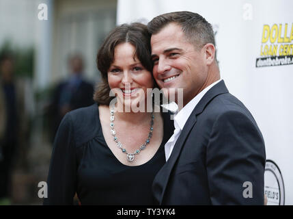 Cast member George Eads (R) of 'Gutshot Straight,' and actress Jorja Fox, who work together on the television show CSI: Crime Scene Investigation, attend the premiere of the motion picture thriller 'Gutshot Straight', at the Zanuck Theatre at Fox Studios in Los Angeles on August 12, 2013.  The crime story follows Eads’s Jack, a poker player who takes on Lang and Levine brothers in the Vegas underworld, with AnnaLynne McCord playing a femme fatale involved in the treachery.    UPI/Danny Moloshok Stock Photo