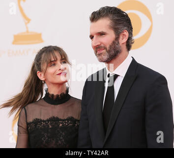 Actress Amanda Peet (L) and producer David Benioff arrive for the 65th Primetime Emmy Awards at Nokia Theatre in Los Angeles on September 22, 2013.   UPI/Danny Moloshok Stock Photo