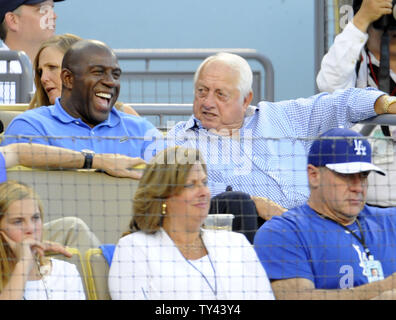 Magic Johnson and Tommy Lasorda share a laugh in the 3rd inning of Game 3 of  the National League Division Series between the Los Angeles Dodgers and Atlanta Braves at Dodger Stadium in Los Angeles on October 6, 2013. The Dodgers won 13-6 to lead the best-of five NLDS 2-1.  UPI/Lori Shepler Stock Photo