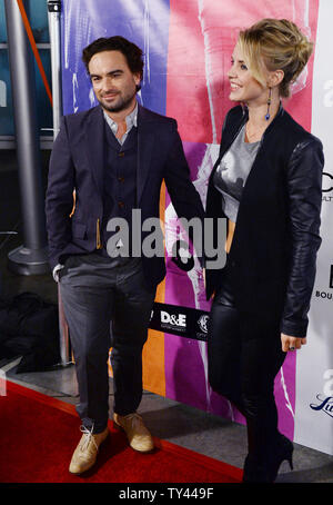 Cast member Johnny Galecki and his girlfriend, actress Kelli Garner attend the premiere of the music history motion picture 'CBGB' at the ArcLight Cinerama Dome in the Hollywood section of Los Angeles on October 1, 2013. 'CBGB' follows the story of Hilly Kristal's New York club from its concept as a venue for Country, Bluegrass and Blues (CBGB) to what it ultimately became: the birthplace of underground rock 'n roll and punk. UPI/Jim Ruymen Stock Photo