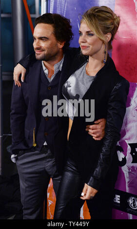 Cast member Johnny Galecki and his girlfriend, actress Kelli Garner attend the premiere of the music history motion picture 'CBGB' at the ArcLight Cinerama Dome in the Hollywood section of Los Angeles on October 1, 2013. 'CBGB' follows the story of Hilly Kristal's New York club from its concept as a venue for Country, Bluegrass and Blues (CBGB) to what it ultimately became: the birthplace of underground rock 'n roll and punk. UPI/Jim Ruymen Stock Photo