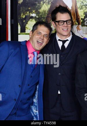 Director/producer Jeff Tremaine (L) and actor/producer/writer Johnny Knoxville attend the premiere of the new motion picture comedy 'Jackass Presents: Bad Grandpa' at TLC Chinese Theatre (formerly Grauman's) in Los Angeles on October 21, 2013. In the film, 86-year-old Irving Zisman is on a journey across America with the most unlikely companion: his 8 year-old grandson, Billy. UPI/Jim Ruymen Stock Photo