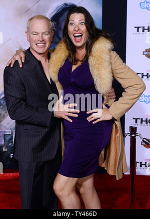 Actor Neal McDonough and his wife, actress Ruve McDonoug, who are expecting their fifth child attend the premiere of the motion picture fantasy 'Thor: The Dark World' at the El Capitan Theatre in the Hollywood section of Los Angeles on November 4, 2013. Storyline: Faced with an enemy that even Odin and Asgard cannot withstand, Thor (Chris Hemsworth) must embark on his most perilous and personal journey yet, one that will reunite him with Jane Foster (Natalie Portman) and force him to sacrifice everything to save us all.  UPI/Jim Ruymen Stock Photo