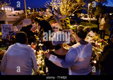 Fans gather at a makeshift memorial to pay respects at the site of the fiery car accident in which actor Paul Walker was killed in Santa Clarita, California, on December 4, 2013. Fans and fellow actors mourned the death of Paul Walker, who died in a fiery car crash on Saturday, December 1, 2013. Walker, 40, who was best known as undercover agent Brian O'Connor in the 'Fast and Furious' action movies, appeared in all but one of the six movies in the popular franchise, and was a leading protagonist along with Vin Diesel and Michelle Rodriguez. UPI/Jim Ruymen Stock Photo