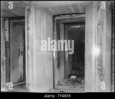 Flashlight showing downstream side of gates of sluicing tunnel.; Scope and content:  Photograph from Volume One of a series of photo albums documenting the construction of Roosevelt Dam, Stewart Dam, and other related work on the Salt River Project in Arizona. Stock Photo