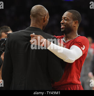 Los Angeles Lakers shooting guard Kobe Bryant, left, and Miami Heat shooting guard Dwyane Wade, right, talk at the end of the game at Staples Center in Los Angeles on December 25, 2013. The Heat won 101-95. UPI/Lori Shepler Stock Photo