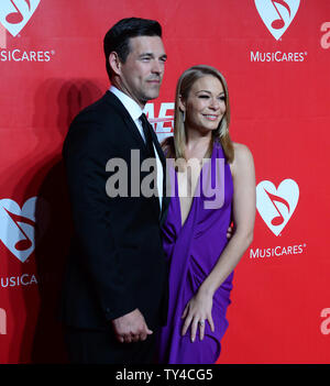 Singer LeAnn Rimes and her husband, actor Eddie Cibrian attend the MusiCares Person of the Year gala honoring singer and songwriter Carole King at the Los Angeles Convention Center in Los Angeles on January 24, 2014.  UPI/Jim Ruymen Stock Photo