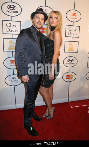 Gavin Degraw (L) and Delta Goodrem arrive on the red carpet before the annual Clive Davis Pre-Grammy Gala in Beverly Hills, California on January 25, 2014.   UPI/David Silpa Stock Photo