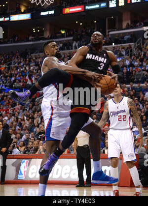 Miami Heat Dwayne Wade is fouled by Los Angeles Clippers DeAndre Jordan in first half action in Los Angeles on February 5, 2014.   UPI/Jon SooHoo Stock Photo