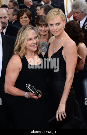 Actress Charlize Theron (R) and her mother Gerda Maritz arrive on the red carpet at the 86th Academy Awards at the Hollywood and Highland Center in the Hollywood section of Los Angeles on March 2, 2014. UPI/Jim Ruymen Stock Photo