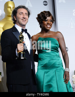 Director Paolo Sorrentino (L) holds the award he won for  Best Foreign Language Film for 'The Great Beauty' and  actress Viola Davis backstage during the 86th Academy Awards at the Hollywood & Highland Center on March 2, 2014 in the Hollywood section of Los Angeles. UPI/Jim Ruymen Stock Photo