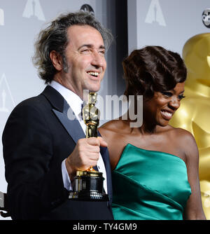 Director Paolo Sorrentino (L) holds the award he won for  Best Foreign Language Film for 'The Great Beauty' and  actress Viola Davis backstage during the 86th Academy Awards at the Hollywood & Highland Center on March 2, 2014 in the Hollywood section of Los Angeles. UPI/Jim Ruymen Stock Photo