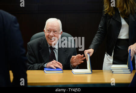 Former U.S. President Jimmy Carter signs copies of his new book 'A Call to Action: Women, Religion, Violence and Power' at a Barnes & Noble in Los Angeles on March 28, 2014. In the book Carter says he believes the biggest challenge facing our world today is the subjugation and abuse of women and girls that manifests itself across the world in the form of child marriage, unequal pay, female genital mutilation, human trafficking, and more. UPI/Jim Ruymen