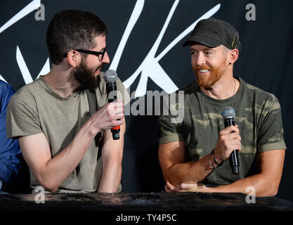 Members of the American rock band Linkin Park Brad Delson (L) and Dave Farrell participate in a ceremony inducting the group into Guitar Center's RockWalk in the Hollywood section of Los Angeles on June 18, 2014. UPI/Jim Ruymen Stock Photo