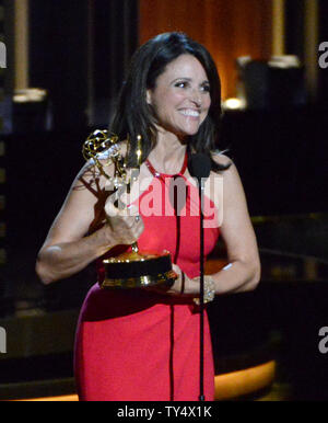 Julia Louis-Dreyfus accepts the award for outstanding lead actress in a comedy series for her work on 'Veep' at the Primetime Emmy Awards at the Nokia Theatre in Los Angeles on August 25, 2014.     UPI/Pat Benic Stock Photo