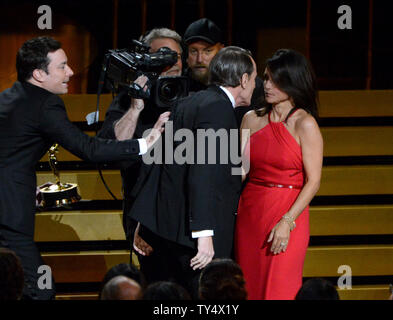 Bryan Cranston looks at Julia Louis-Dreyfus as she gets ready to go onstage to accept the outstanding lead actress in a comedy series for her work on 'Veep' during the Primetime Emmy Awards at the Nokia Theatre in Los Angeles on August 25, 2014.     UPI/Pat Benic