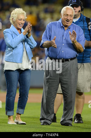 Former manager Tommy Lasorda and his wife Jo Lasorda walk on the field as  the Dodgers
