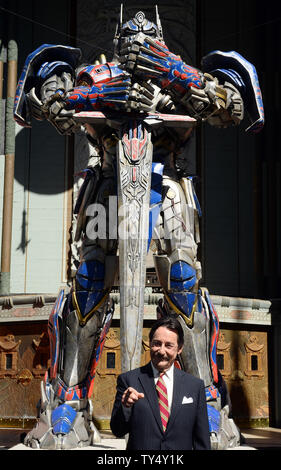 Canadian voice actor Peter Cullen raises his hands during a handprint ...