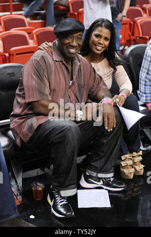 Miami, United States Of America. 03rd Sep, 2012. MIAMI, FL - FEBRUARY 27: Michael Clarke Duncan Omarosa Manigault Stallworth at The Miami Heat vs New York Knicks Games at AmericanAirlines Arena on February 27, 2011 in Miami, Florida. ( Credit: Storms Media Group/Alamy Live News Stock Photo