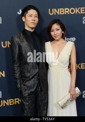 Cast member Takamasa Ishihara aka 'Miyavi' and his wife, pop singer Miyuki Ishihara attend the premiere of the biographical motion picture war drama 'Unbroken' at the Dolby Theatre in the Hollywood section of Los Angeles on December 15, 2014. Storyline: After a near-fatal plane crash in WWII, Olympian Louis Zamperini spends a harrowing 47 days in a raft with two fellow crewmen before he's caught by the Japanese navy and sent to a prisoner-of-war camp.  UPI/Jim Ruymen Stock Photo