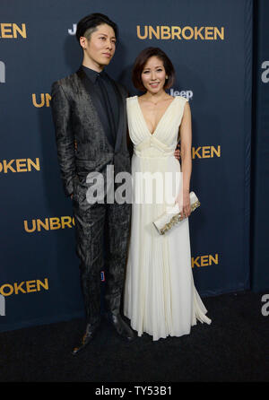 Cast member Takamasa Ishihara aka 'Miyavi' and his wife, pop singer Miyuki Ishihara attend the premiere of the biographical motion picture war drama 'Unbroken' at the Dolby Theatre in the Hollywood section of Los Angeles on December 15, 2014. Storyline: After a near-fatal plane crash in WWII, Olympian Louis Zamperini spends a harrowing 47 days in a raft with two fellow crewmen before he's caught by the Japanese navy and sent to a prisoner-of-war camp.  UPI/Jim Ruymen Stock Photo