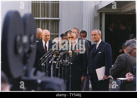 General William Westmoreland Press Conference Outside the White House; Scope and content:  Location: White House exterior. Depicted: Secretary of State Dean Rusk, General William Westmoreland, President Lyndon B. Johnson, others in background. Stock Photo