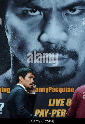 Manny Pacquiao of the Philippines departs a news conference promoting his upcoming boxing match with U.S. boxer Floyd Mayweather in Los Angeles on March 11, 2015.  The fight is set for May 2nd in Las Vegas.  Photo by Jim Ruymen/UPI Stock Photo