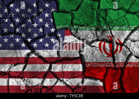 Crisis and confliction concept of america and iran . flags on cracked ground background Stock Photo