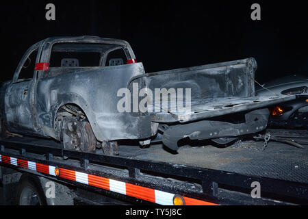 One of 30 cars destroyed when a brush fire spread to vehicles trapped along interstate 15 in the Cajon Pass in San Bernardino County sits on a lot for processing on July 17, 2015. The fast-moving wildfire jumped the busy I-15 freeway, the main roadway connecting Los Angeles and Las Vegas, setting 30 cars, 4 homes and a big-rig on fire while torching nearly 4,000 acres of land.  Photo by Jim Ruymen/UPI Stock Photo