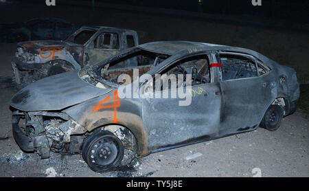 One of 30 cars destroyed when a brush fire spread to vehicles trapped along interstate 15 in the Cajon Pass in San Bernardino County sits on a lot for processing on July 17, 2015. The fast-moving wildfire jumped the busy I-15 freeway, the main roadway connecting Los Angeles and Las Vegas, setting 30 cars, 4 homes and a big-rig on fire while torching nearly 4,000 acres of land.  Photo by Jim Ruymen/UPI Stock Photo