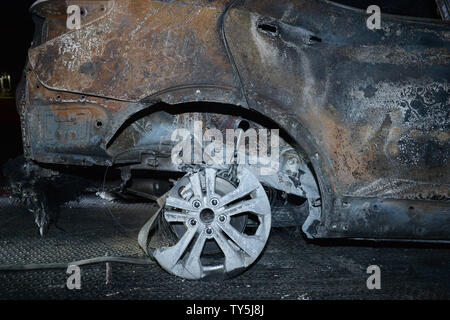 One of 30 cars destroyed when a brush fire spread to vehicles trapped along interstate 15 in the Cajon Pass in San Bernardino County sits on a lot for processing on July 17, 2015. The fast-moving wildfire jumped the busy I-15 freeway, the main roadway connecting Los Angeles and Las Vegas, setting 30 cars, 4 homes and a big-rig on fire while torching nearly 4,000 acres of land.  Photo by Jim Ruymen/UPI Stock Photo