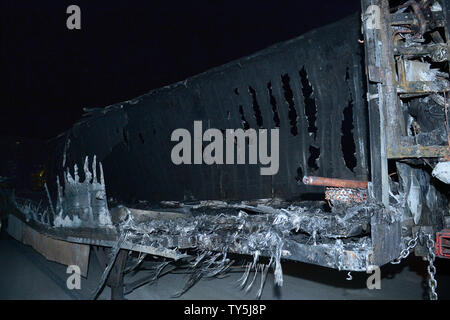 A big-rig destroyed when a brush fire spread to vehicles trapped along interstate 15 in the Cajon Pass in San Bernardino County sits on a lot for processing on July 17, 2015. The fast-moving wildfire jumped the busy I-15 freeway, the main roadway connecting Los Angeles and Las Vegas, setting 30 cars, 4 homes and a big-rig on fire while torching nearly 4,000 acres of land.  Photo by Jim Ruymen/UPI Stock Photo