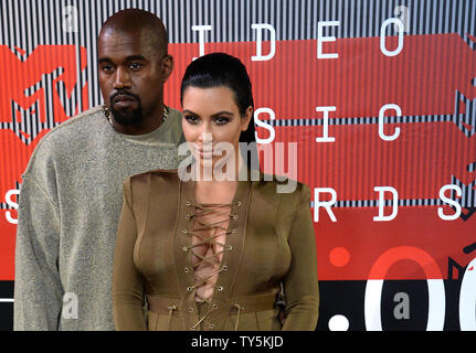 Rapper Kanye West and TV personality Kim Kardashian arrive on the red carpet for the 32nd annual MTV Video Music Awards at Microsoft Theater in Los Angeles on August 30, 2015. Photo by Jim Ruymen/UPI Stock Photo