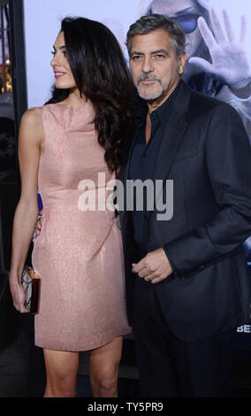 Actor and producer George Clooney and his wife, human rights attorney Amal Alamuddin Clooney attend the premiere of the motion picture dramatic comedy 'Our Brand Is Crisis' at the TCL Chinese Theatre in the Hollywood section of Los Angeles on October 26, 2015. Storyline: An American woman, well-versed in political campaigns, is sent to the war-torn lands of South America to help install a new leader but is threatened to be thwarted by a long-term rival. Photo by Jim Ruymen/UPI Stock Photo