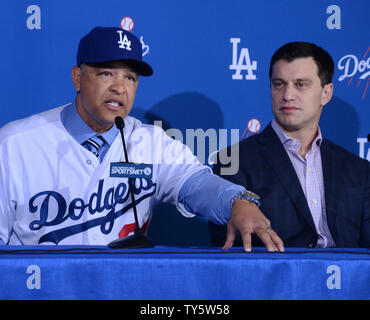 Dave Roberts, a former Dodger dons his new jersey as he is introduced as  the 10th manager of the Los Angeles Dodgers and the 28th in franchise  history, saying the post was