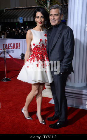 Actor George Clooney (R) and his wife, human rights attorney Amal Clooney attend the 'Hail, Caesar!' premiere at the Regency Village Theatre in the Westwood section of Los Angeles on February 1, 2016. Storyline: Hail Caesar! follows a day in the life of Eddie Mannix, a Hollywood fixer for Capital Pictures in the 1950s, who cleans up and solves problems for big names and stars in the industry. But when studio star Baird Whitlock disappears, Mannix has to deal with more than just the fix.   Photo by Jim Ruymen/UPI Stock Photo