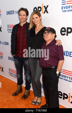 Actor/producer/screenwriter Glenn Howerton, from left, actress/model/television personality Jill Latiano Howerton and actor Danny Devito attend the premiere of the documentary 'Under the Gun' at the Academy of Motion Picture Arts & Sciences (AMPAS) in Beverly Hills, California on May 3, 2016. Storyline: First hand accounts from parents of Sandy Hook victims, expert commentary and statistics reveal the state of American gun violence and gun control laws. Photo by Michael Owen Baker/UPI Stock Photo