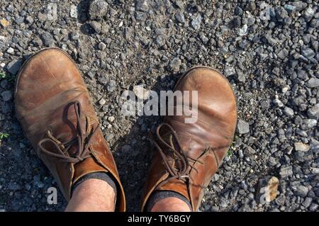 men's legs in jeans and old travel vintage leather boots shoes Stock Photo  - Alamy