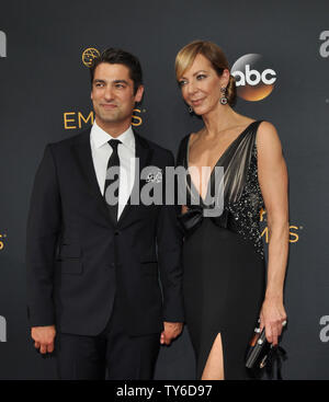 Actress Allison Janney (R) and Philip Joncas arrive for the 68th annual Primetime Emmy Awards at Microsoft Theater in Los Angeles on September 18, 2016. Photo by Christine Chew/UPI Stock Photo