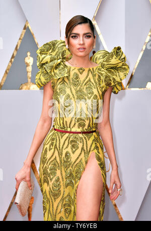 Actress Bianca Blanco arrives with an assortment of Oscar-themed food ...