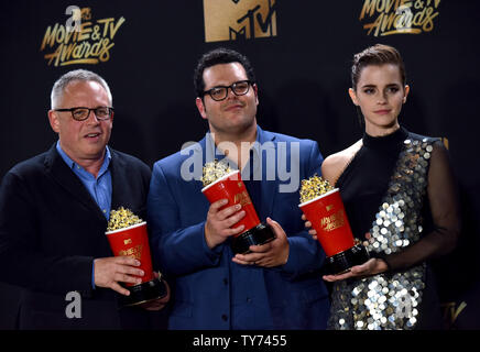 Director Bill Condon and actors Josh Gad and Emma Watson appear backstage with the Movie Of The Year award for Beauty and the Beast during the MTV Movie & TV Awards at the Shrine Auditorium in Los Angeles on May 7, 2017. It will be the 26th edition of the awards, and will for the first time present honors for work in television as well as cinema.  Photo by Christine Chew/UPI Stock Photo