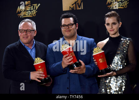 Director Bill Condon and actors Josh Gad and Emma Watson appear backstage with the Movie Of The Year award for Beauty and the Beast during the MTV Movie & TV Awards at the Shrine Auditorium in Los Angeles on May 7, 2017. It will be the 26th edition of the awards, and will for the first time present honors for work in television as well as cinema.  Photo by Christine Chew/UPI Stock Photo