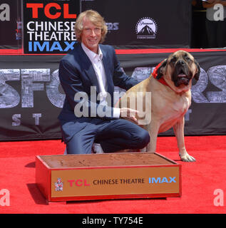 Director Michael Bay is joined by his dog Rebel during a hand and footprint ceremony immortalizing him in the forecourt of TCL Chinese Theatre (formerly Grauman's) in the Hollywood section of Los Angeles on May 23, 2017. Photo by Jim Ruymen/UPI Stock Photo