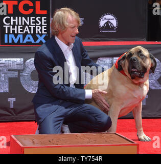 Director Michael Bay is joined by his dog Rebel during a hand and footprint ceremony immortalizing him in the forecourt of TCL Chinese Theatre (formerly Grauman's) in the Hollywood section of Los Angeles on May 23, 2017. Photo by Jim Ruymen/UPI Stock Photo