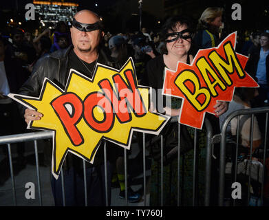 Thousands of people, including families with young children, thronged downtown Los Angeles Thursday night sporting Batman attire and other superhero garb to pay tribute to actor Adam West, best known for playing the Caped Crusader on the 1960s television show 'Batman'. The Batman 'bat signal' was projected onto Los Angeles City Hall in a tribute to the late actor in Los Angeles on June 15, 2017. West, who portrayed Batman in the classic 1966-68 TV series of the same name, died on June 9 at the age of 88. The 'bat-signal' was used in the television show when the fictitious Gotham City Police De Stock Photo