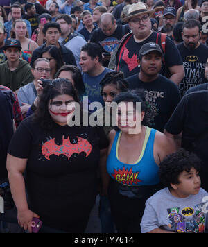 Thousands of people, including families with young children, thronged downtown Los Angeles Thursday night sporting Batman attire and other superhero garb to pay tribute to actor Adam West, best known for playing the Caped Crusader on the 1960s television show 'Batman'. The Batman 'bat signal' was projected onto Los Angeles City Hall in a tribute to the late actor in Los Angeles on June 15, 2017. West, who portrayed Batman in the classic 1966-68 TV series of the same name, died on June 9 at the age of 88. The 'bat-signal' was used in the television show when the fictitious Gotham City Police De Stock Photo